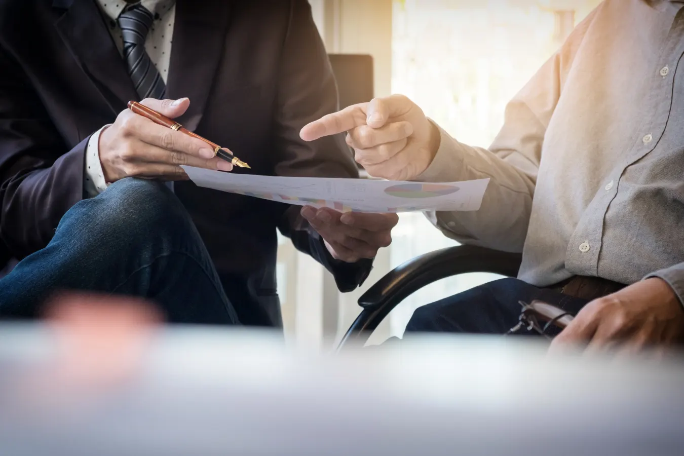 Private sector professionals reviewing a report